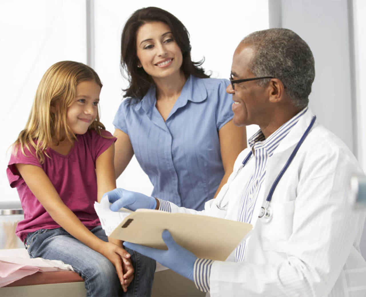 A mother and daughter visiting a doctor at a Novant Health facility.