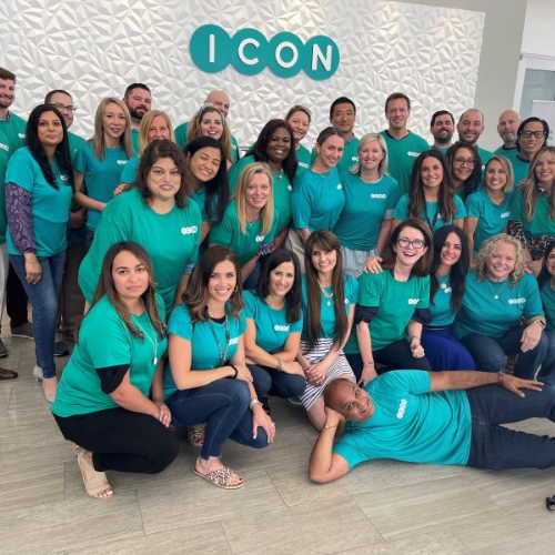 Team picture of ICON employees wearing green company t-shirts