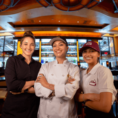 Three employees at The Cheesecake Factory